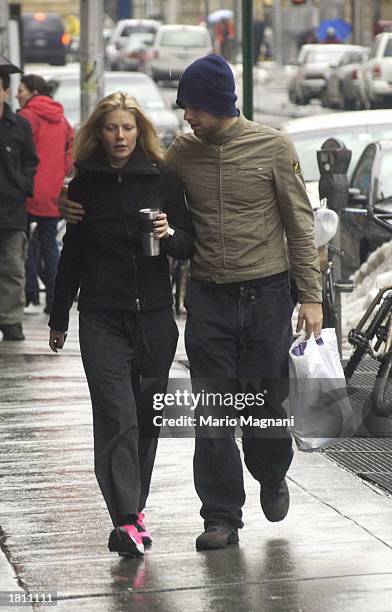 Actress Gwyneth Paltrow walks with her boyfriend musician Chris Martin of Coldplay February 23, 2003 in New York City.