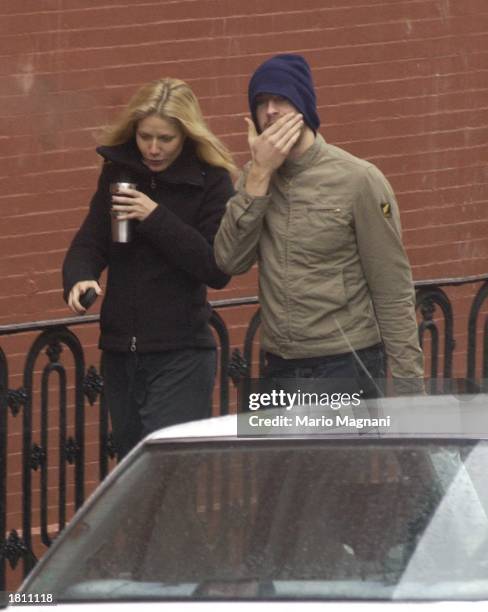 Actress Gwyneth Paltrow walks with her boyfriend musician Chris Martin of Coldplay February 23, 2003 in New York City.