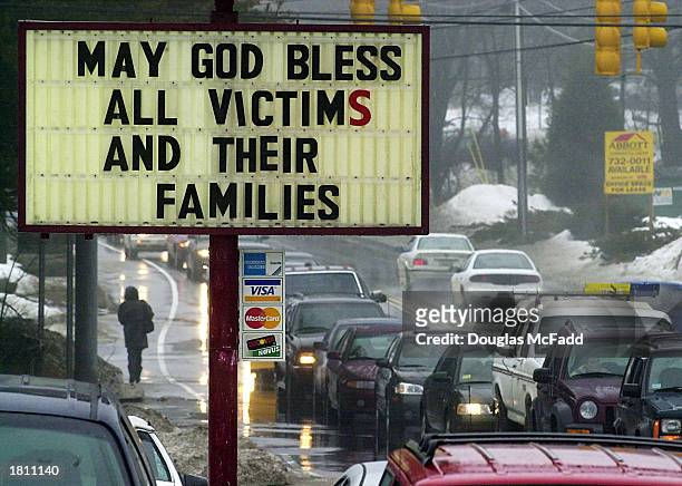 Sign shows a message near the scene a deadly fire at the "The Station" nightclub February 23, 2003 in West Warwick, Rhode Island. The fire, that took...