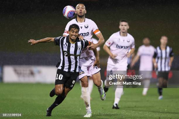 Ulises Dávila of Macarthur FC competes for the ball against Roderick Miranda of Melbourne Victory during the A-League Men round five match between...