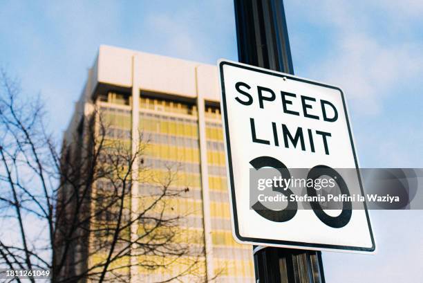 30 speed limit sign in residential district - speed limit sign stock pictures, royalty-free photos & images