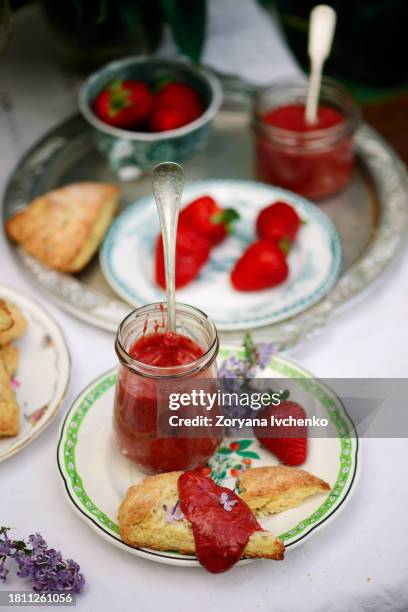 lilac scones with strawberry curd in the summer garden - chandler strawberry stock pictures, royalty-free photos & images