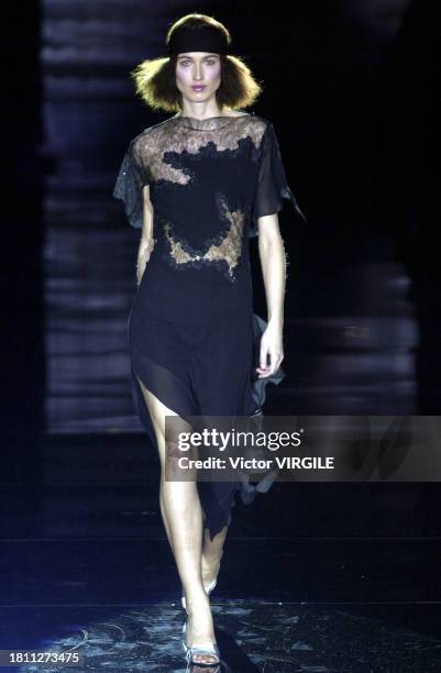 Sylvia Van Der Klooster walks the runway during the Julien Macdonald Ready to Wear Fall/Winter 2002-2003 fashion show as part of the London Fashion...