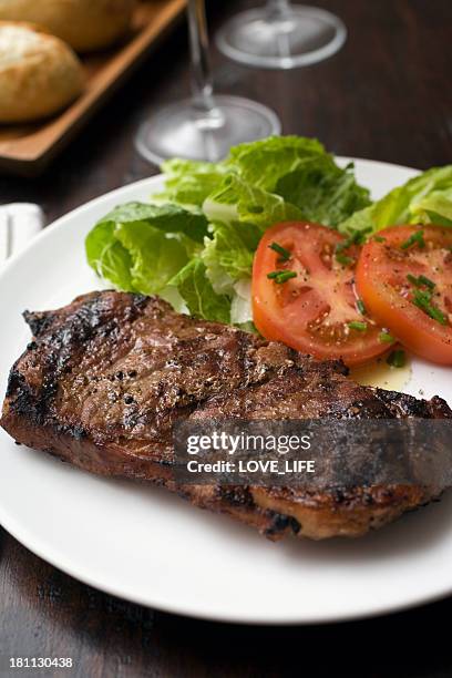 simple steak dinner - grilled tomatoes stock pictures, royalty-free photos & images