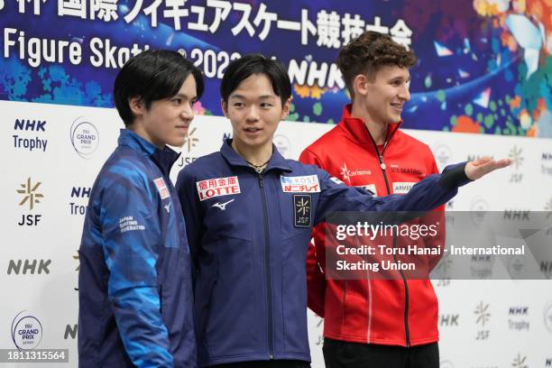 Shoma Uno of Japan, Yuma Kagiyama of Japan and Lukas Britschgi of Switzerland attend a photo session before a press conference following the Men’s...