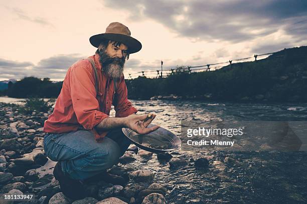 gold panning,successful prospector with nugget - gold panning stock pictures, royalty-free photos & images