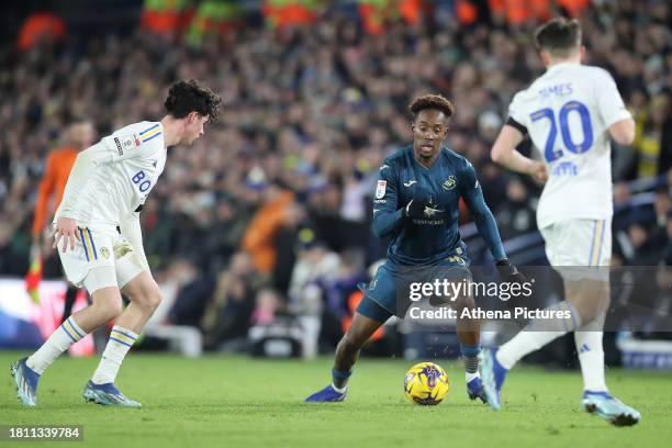 Jamal Lowe of Swansea City closely matrked by Archie Gray and Daniel James of Leeds United during the Sky Bet Championship match between Leeds United...