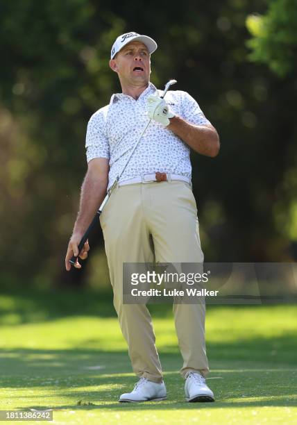 Louis De Jager of South Africa reacts after playing his approach shot on the 15th hole during Day Two of the Joburg Open at Houghton GC on November...