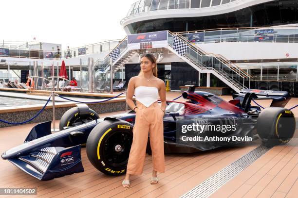 Bianca Bustamante poses beside a Formula 1 car at the Atmosphere Pool following a Q&A with Laura Winter as Global partner of Formula 1®, MSC Cruises,...
