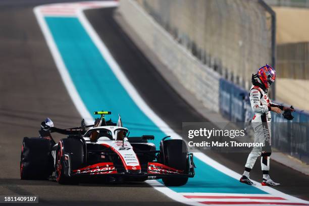 Nico Hulkenberg of Germany and Haas F1 walks from his car after crashing during practice ahead of the F1 Grand Prix of Abu Dhabi at Yas Marina...