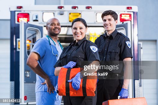 Paramedics and doctor outside ambulance Paramedics and doctor outside ambulance
