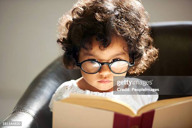 intelligent little bookworm - kids reading glasses stock pictures, royalty-free photos & images