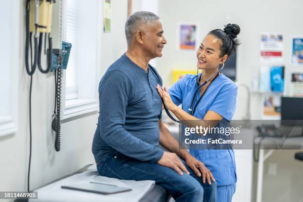 heart check-up - spanish and portuguese people stock pictures, royalty-free photos & images
