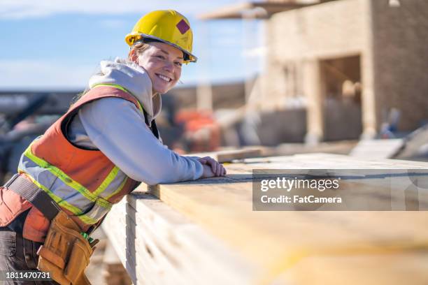 female construction worker portrait - construction worker stock pictures, royalty-free photos & images