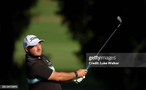 Zander Lombard of South Africa plays his approach shot on the 17th hole during Day Two of the Joburg Open at Houghton GC on November 24, 2023 in...