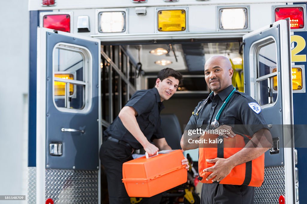 Paramedics at back of ambulance