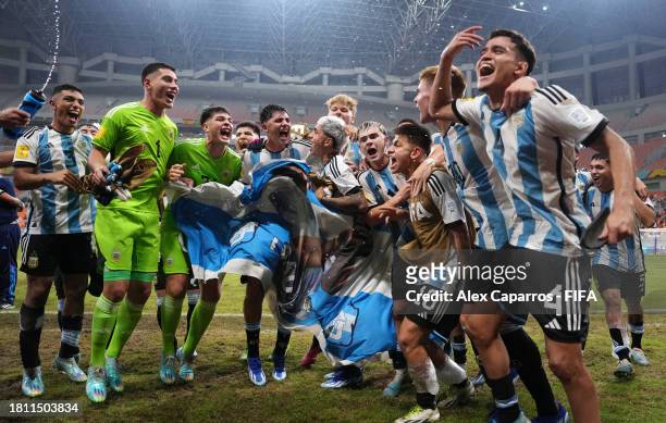Players of Argentina celebrate following the team's victory in the FIFA U-17 World Cup Quarter Final match between Argentina and Brazil at Jakarta...