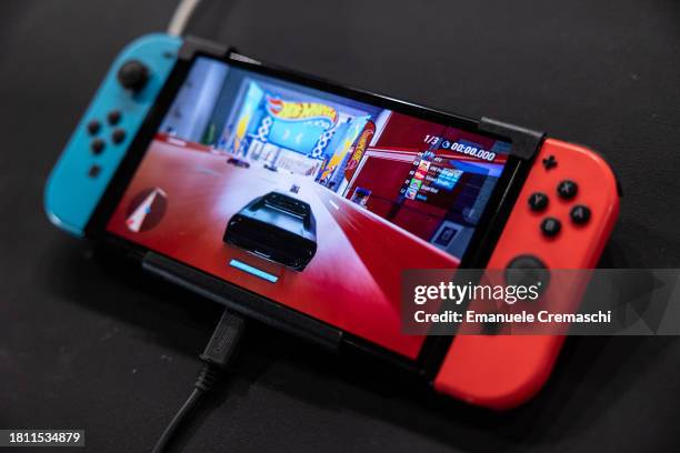 General picture shows an Oled model Nintendo Switch gaming system at the Japanese publisher Nintendo Switch's stand during Milan Games Week 2023 at...