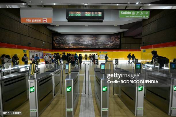 Picture of exit turnstiles at the San Francisco subway station of Quito's Metro Line 1, in downtown Quito taken on November 28 as people open...