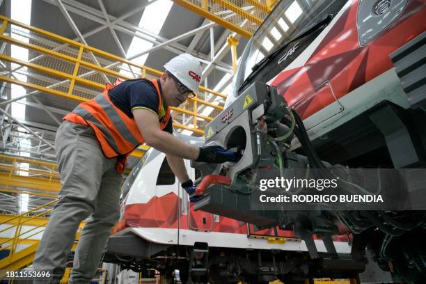 Technician of the Spanish company CAF checks the systems of a train at the maintenance and repair facility of Quito's Metro Line 1 near the...