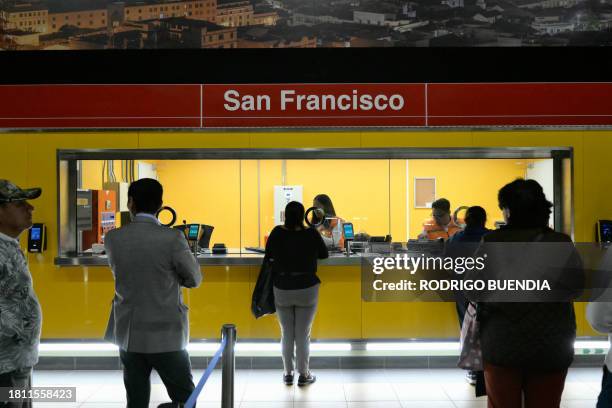 Commuters buy tickets at the San Francisco subway station of Quito's Metro Line 1, in downtown Quito on November 28, 2023. After a decade of work and...