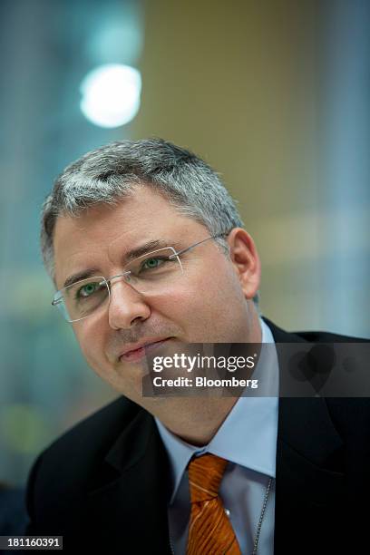 Severin Schwan, chief executive officer Roche Holding AG, listens during an interview in New York, U.S., on Thursday, Sept. 19, 2013. Roche Holding...