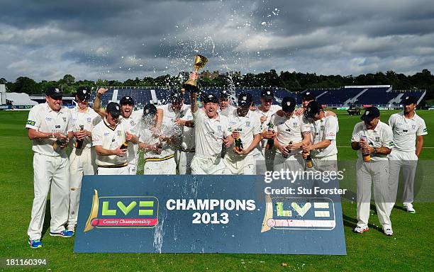 Durham captain Paul Collingwood and team celebrate with the trophy after winning the LV County Championship Division One title after day three of the...