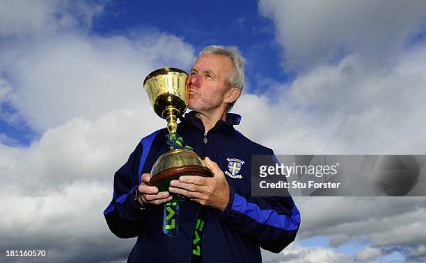 Durham coach Geoff Cook kisses the trophy after winning the LV County Championship Division One title after day three of the LV County Championship...