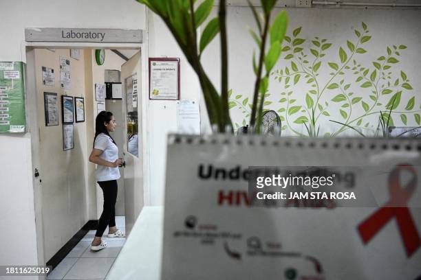 In this photo taken on May 10 shows a staff entering a laboratory at a social hygiene clinic in Quezon City, Metro Manila. The spread of HIV has...