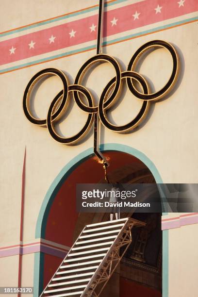 Rafer Johnson of the USA raises the Olympic Torch to light the Olympic Flame during the Opening Ceremony of the 1984 Summer Olympics at the Los...