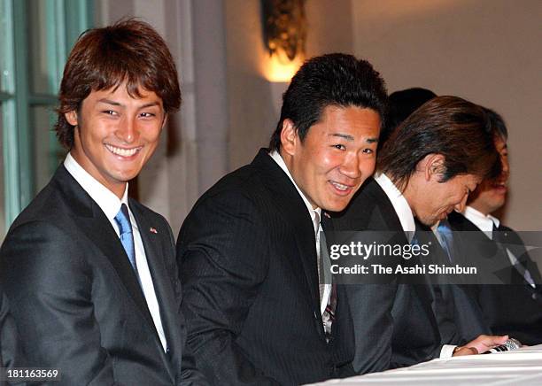 Pitcher Yu Darvish and Masahiro Tanaka of Japan smiles during a press conference held a day after winning the World Baseball Classic on March 24,...