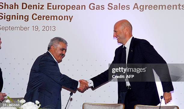 Rovnag Abdullayev , the President of Azerbaijan's State Oil Company 'Shah Deniz', shakes hands with Gianfilippo Mancini, director of the Market...