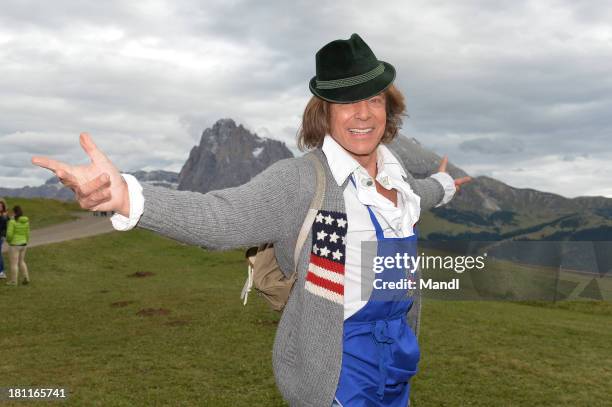 Juergen Drews pose for media after the recording of the TV Show 'ZDF Fernsehgarten' at Seiser Alm near Kastelruth on September 18, 2013 in...