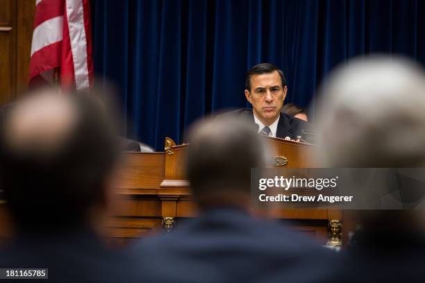 Chairman Darrell Issa listen to testimony from witnesses during a House Oversight Committee hearing entitled 'Reviews of the Benghazi Attack and...