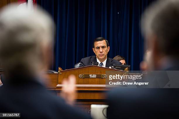Chairman Darrell Issa listen to testimony from witnesses during a House Oversight Committee hearing entitled 'Reviews of the Benghazi Attack and...