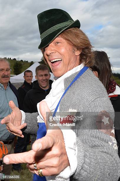 Juergen Drews pose for media after the recording of the TV Show 'ZDF Fernsehgarten' at Seiser Alm near Kastelruth on September 18, 2013 in...