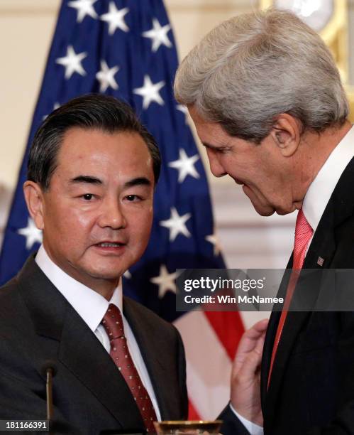 Secretary of State John Kerry and Chinese Foreign Minister Wang Yi after delivering opening statements prior to the start of bilateral meetings at...