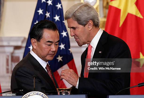 Secretary of State John Kerry and Chinese Foreign Minister Wang Yi after delivering opening statements prior to the start of bilateral meetings at...
