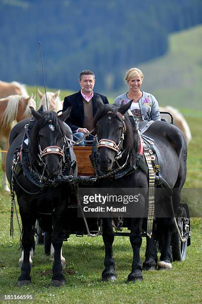Andrea Kiewel and Joachim Llambi during the recording of the TV Show 'ZDF Fernsehgarten' at Seiser Alm near Kastelruth on September 18, 2013 in...