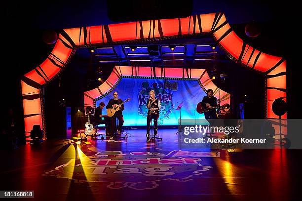 Sarah Connor performs live on stage during the Ferrero kinderTag 2013 event at Heidepark on September 19, 2013 in Soltau, Germany.