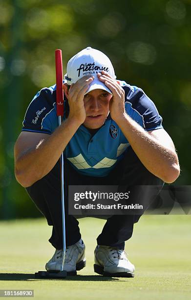 Maximilian Kieffer of Germany lines up a putt during the first round of the Italian Open golf at Circolo Golf Torino on September 19, 2013 in Turin,...