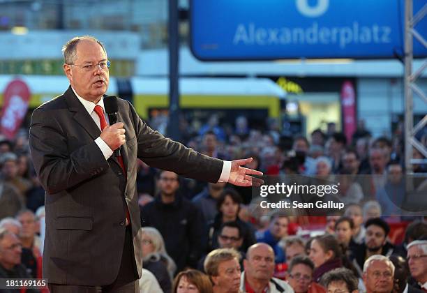 German Social Democrats chancellor candidate Peer Steinbrueck speaks to visitors at an SPD election rally on September 16, 2013 in Berlin, Germany....