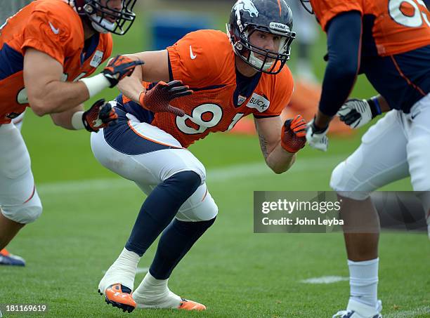 Denver Broncos tight end Joel Dreessen runs through drills during practice September 19, 2013 at Dove Valley.