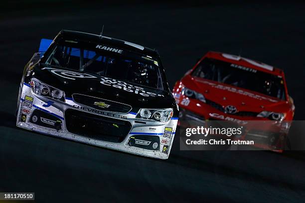 Kasey Kahne, driver of the Time Warner Cable Chevrolet, and Matt Kenseth, driver of the The Home Depot / Husky Toyota, during the NASCAR Sprint Cup...