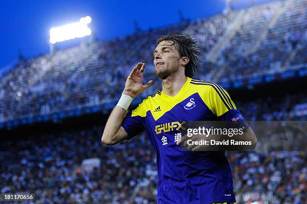 Michu of Swansea City celebrates after scoring his team's second goal the UEFA Europa League Group A match between Valencia CF and Swansea City at...