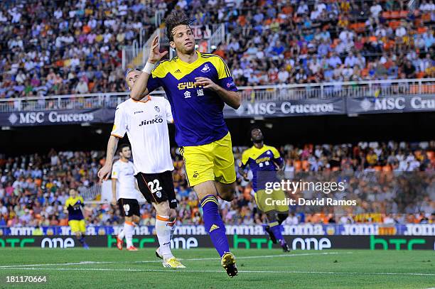 Michu of Swansea City celebrates after scoring his team's second goal during the UEFA Europa League Group A match between Valencia CF and Swansea...