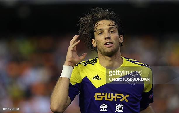Swansea City's Spanish midfielder Miguel Michu celebrates after scoring during the UEFA Europa league football match Valencia CF vs Swansea City AFC...