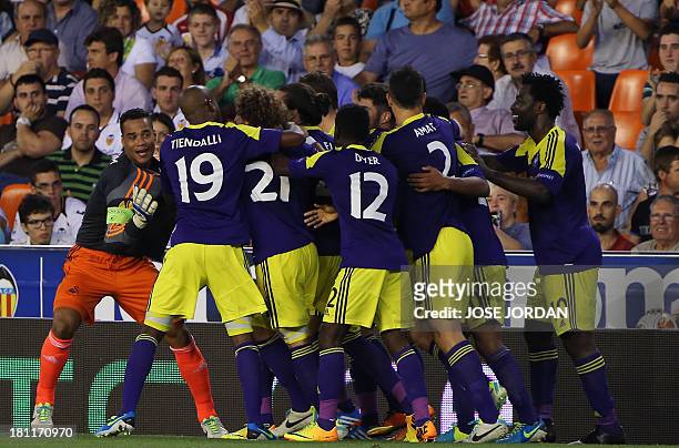 Swansea City's players celebrate their third score during the UEFA Europa league football match Valencia CF vs Swansea City AFC at the Mestalla...