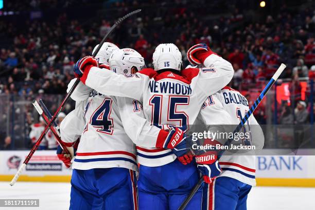 Alex Newhook of the Montreal Canadiens celebrates his second period goal with his teammates during a game against the Columbus Blue Jackets at...