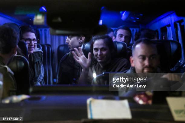 Van carries hostages released by Hamas from Gaza earlier this evening, including Yarden Roman seen waving on November 30, 2023 in Ofakim, Israel....